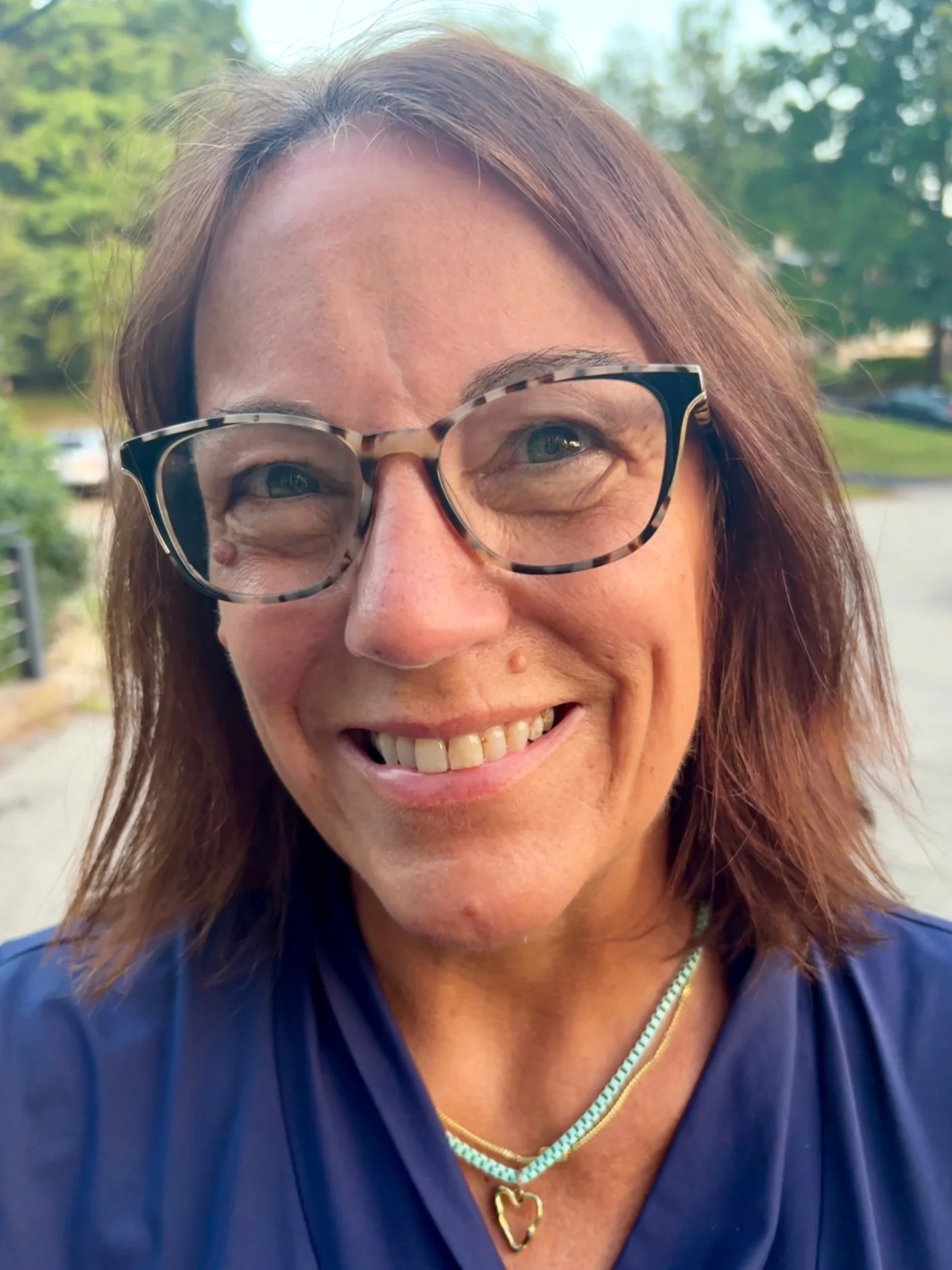 Penny McAllister smiling outdoors.